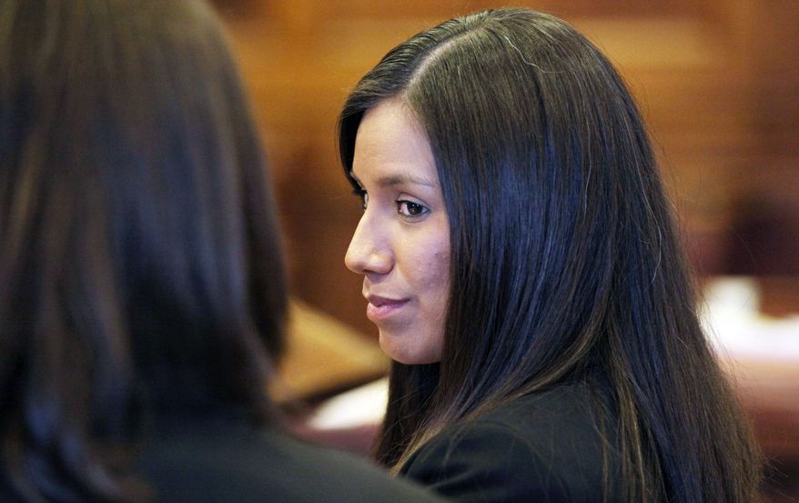 Alexis Wright, 29, a Zumba instructor, is facing 109 counts of prostitution, violation of privacy, tax evasion and other charges for allegedly providing sex for money at her Kennebunk fitness studio and office. Some men are facing charges of engaging in prostitution. (Associated Press)