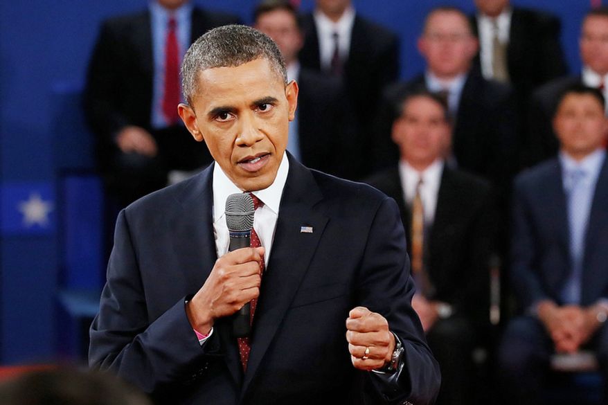 President Barack Obama answers a question during the second presidential debate. (AP Photo/Pool, Rick Wilking)
