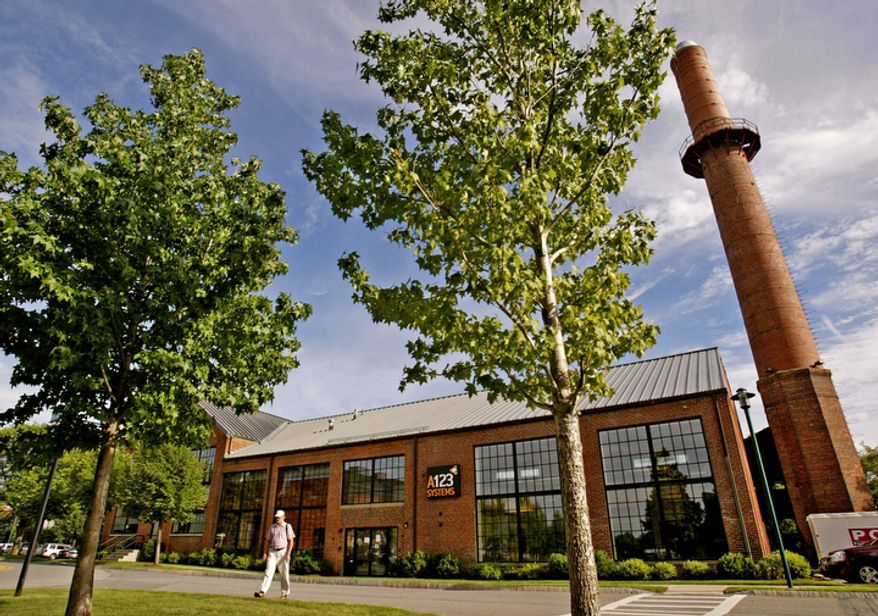 In this Aug. 9, 2007, photo, a man walks from the A123 Systems Inc., in Watertown, Mass. After years of struggling with weak sales and mounting losses, the electric-car battery maker filed for bankruptcy protection and reached a deal to sell its automotive assets, Tuesday, Oct. 16, 2012. (AP Photo/Boston Herald, David Goldman)