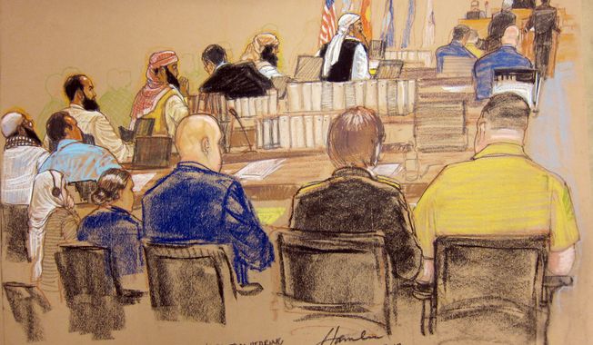 In this photo of a sketch by courtroom artist Janet Hamlin and reviewed by the U.S. Department of Defense, the five Guantanamo prisoners charged in the Sept. 11 attacks, back row from left, Mustafa Ahmad al-Hawsawi, Ali Abd al-Aziz Ali, Ramzi Binalshibh, Walid bin Attash and the alleged mastermind Khalid Sheik Mohammed, attend their Military Commissions pretrial hearing in the Guantanamo Bay U.S. Naval Base in Cuba, Monday, Oct. 15, 2012. The five accused of the Sept. 11 attacks were back before a military tribunal, forgoing the protest that turned their last appearance into an unruly 13-hour spectacle. (AP Photo/Janet Hamlin, Pool)