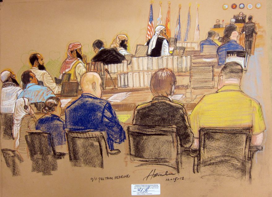 In this photo of a sketch by courtroom artist Janet Hamlin and reviewed by the U.S. Department of Defense, the five Guantanamo prisoners charged in the Sept. 11 attacks, back row from left, Mustafa Ahmad al-Hawsawi, Ali Abd al-Aziz Ali, Ramzi Binalshibh, Walid bin Attash and the alleged mastermind Khalid Sheik Mohammed, attend their Military Commissions pretrial hearing in the Guantanamo Bay U.S. Naval Base in Cuba, Monday, Oct. 15, 2012. The five accused of the Sept. 11 attacks were back before a military tribunal, forgoing the protest that turned their last appearance into an unruly 13-hour spectacle. (AP Photo/Janet Hamlin, Pool)