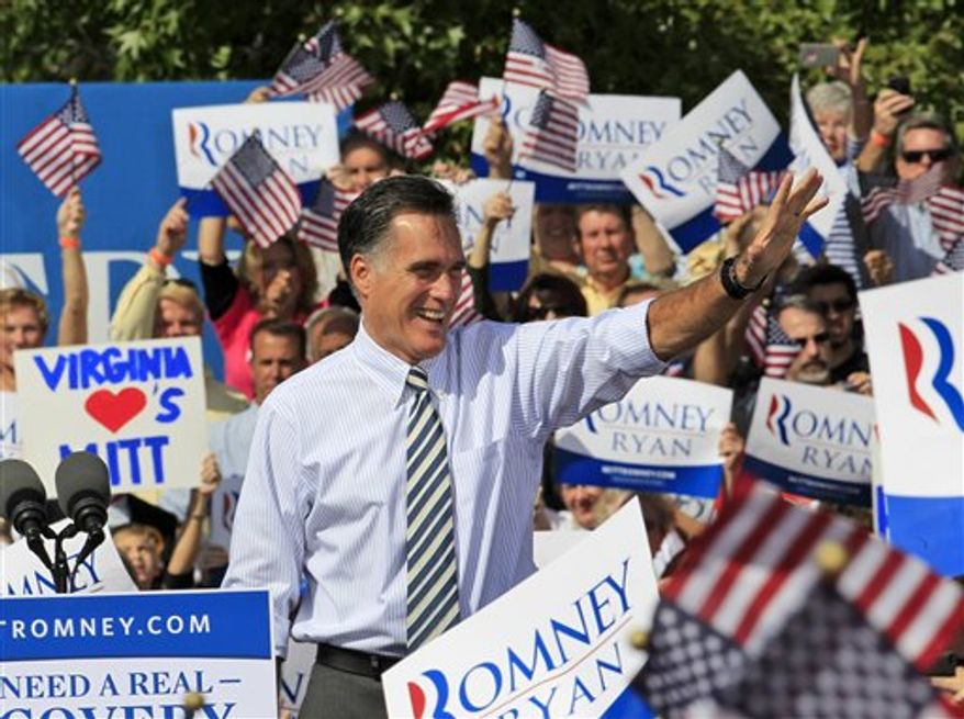 **FILE** Republican presidential candidate Mitt Romney waves to supporters as he arrives Oct. 17, 2012, for a rally at Tidewater Community College in Chesapeake, Va. (Associated Press)