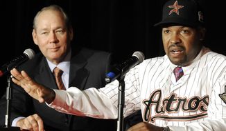 Houston Astros&#39; new manager Bo Porter, right, with owner Jim Crane, answers questions during a news conference, Thursday, Oct. 18, 2012, in Houston. (AP Photo/Pat Sullivan)