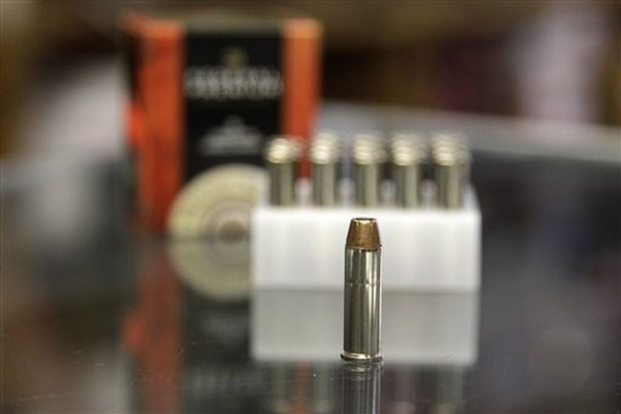 In this Wednesday, Oct. 17, 2012, photo, a box of ammunition is seen on the counter of a gun shop in Tinley Park, Ill. Cook County Board President Toni Preckwinkle is set to make official her latest tax target: bullets. On Thursday, Oct. 18, she will propose a tax of 5 cents a bullet and a dollar for a box of 20. (AP Photo/M. Spencer Green)