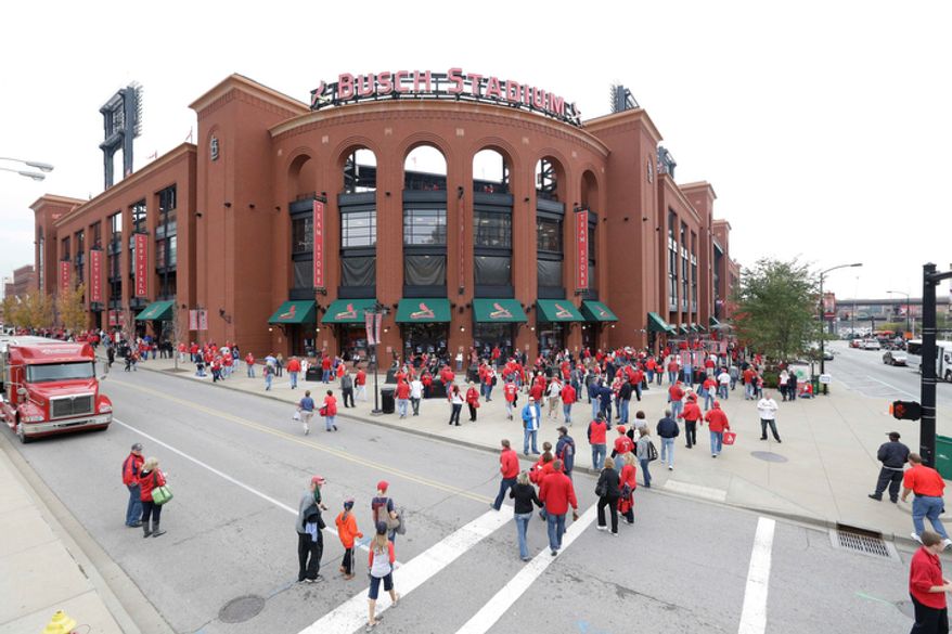 Fans arrive at the Busch Stadium for Game 3 of baseball's National League championship series between the St. Louis Cardinals and the San Francisco Giants, Wednesday, Oct. 17, 2012, in St. Louis. (AP Photo/Patrick Semansky)
