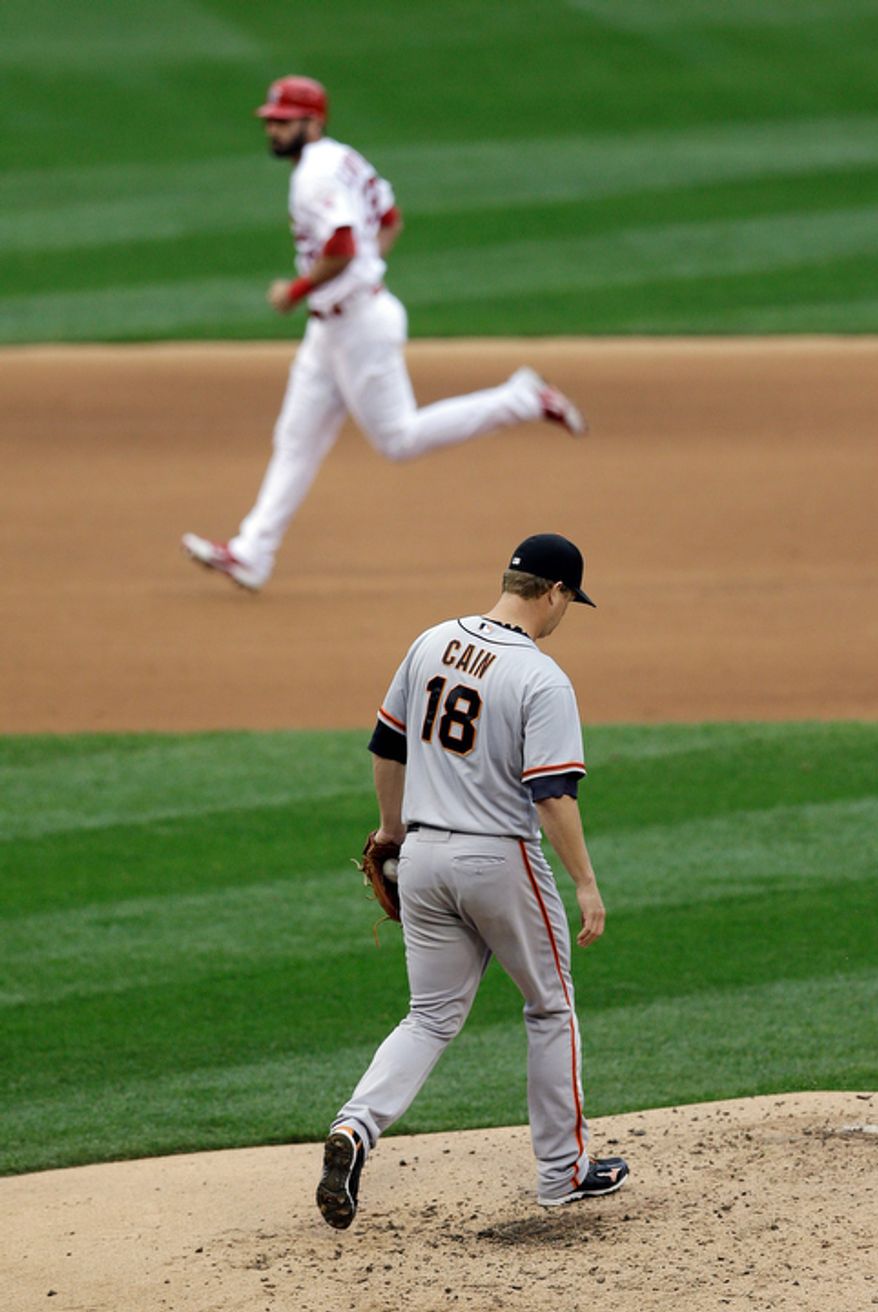 San Francisco Giants starting pitcher Matt Cain (18) reacts as St. Louis Cardinals' Matt Carpenter (13) runs the bases as he hit a two-run home run during the third inning of Game 3 of baseball's National League championship series, Wednesday, Oct. 17, 2012, in St. Louis. (AP Photo/Patrick Semansky)