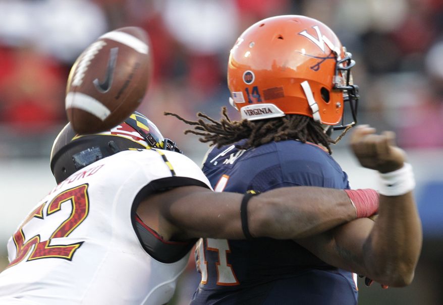 Maryland linebacker Darin Drakeford (52) forces a fumble by Virginia quarterback Phillip Sims during the second half of an NCAA college football game in Charlottesville, Va., Saturday, Oct. 13, 2012. Maryland won 27-20. (AP Photo/Steve Helber)