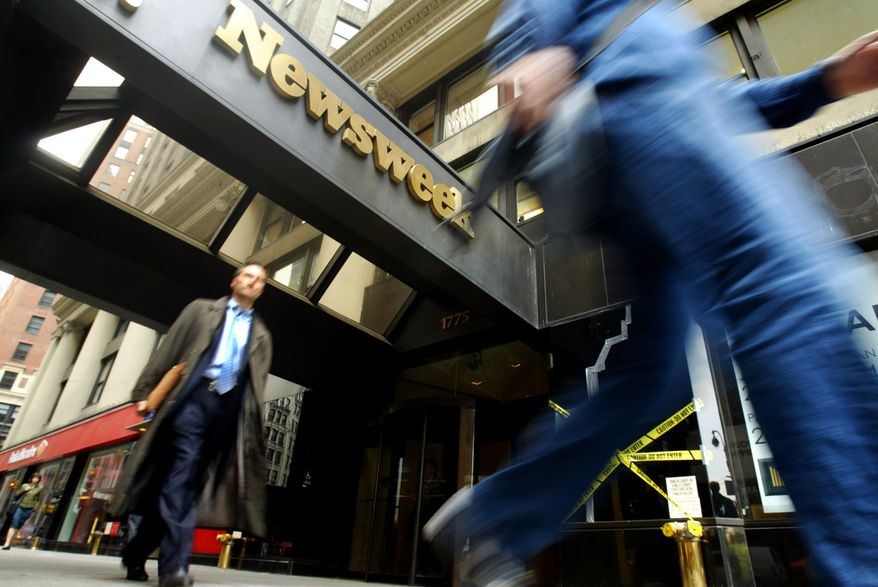 Pedestrians pass the Broadway entrance to the Newsweek building in New York in 2005. (AP Photo/Mary Altaffer)