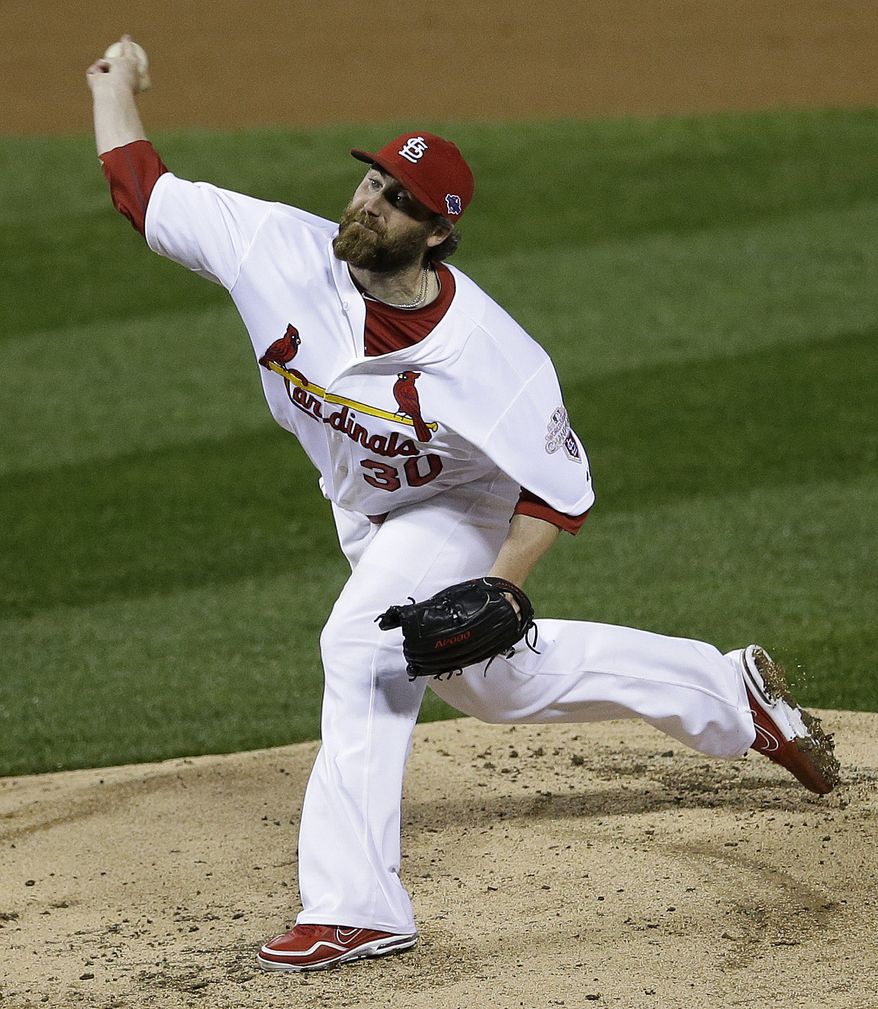 St. Louis Cardinals relief pitcher Jason Motte (30) works during the eighth inning of Game 3 of baseball's National League championship series against the San Francisco Giants, Wednesday, Oct. 17, 2012, in St. Louis. (AP Photo/Patrick Semansky)