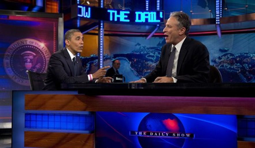 President Obama talks with host Jon Stewart during a taping of &quot;The Daily Show With Jon Stewart&quot; in New York on Oct. 18, 2012. (Associated Press) **FILE**