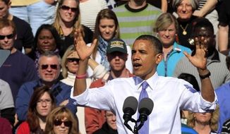 President Barack Obama gestures while speaking at a campaign stop, Thursday, Oct. 18, 2012, in Manchester, N.H. (AP Photo/Jim Cole)