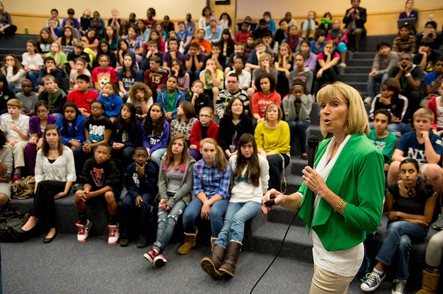 U.S. Geological Survey Director Marcia McNutt speaks to Langston Hughes Middle School about her job and the roll her organization has with earthquakes following the school's participation in the Great ShakeOut national earthquake drill, Reston, Va., Thursday, October 18, 2012. Students in the Washington, D.C. region are now participating in the earthquake preparation program for the first time after a 5.8 magnitude earthquake struck the area in August 2011. According to the program's website, an estimated 18 million people are participating this year. (Andrew Harnik/The Washington Times)