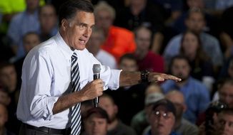** FILE ** In this Oct. 10, 2012, file photo, Republican presidential candidate, former Massachusetts Gov. Mitt Romney gestures during a town hall meeting at Ariel Corp. in Mt. Vernon, Ohio. (AP Photo/ Evan Vucci, File)