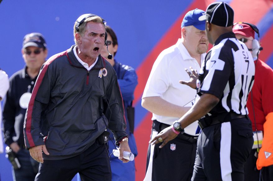 Washington Redskins head coach Mike Shanahan yells at Side Judge Keith Washington during a break in action in the first quarter at MetLife Stadium, East Rutherford, N.J., Oct. 21, 2012. (Preston Keres/Special to The Washington Times)