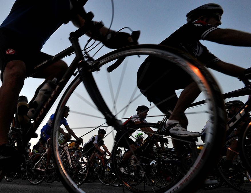 Riders begin their 100-mile ride at the Livestrong Challenge Austin charity event on Sunday, Oct. 21, 2012, in Austin, Texas. Lance Armstrong greeted about 4,300 cyclists at his Livestrong charity's fundraiser and then retreated into privacy as cycling officials got set to announce if they will appeal his lifetime ban and loss of seven Tour de France titles ordered by the U.S. Anti-Doping Agency. (AP Photo/Michael Thomas)