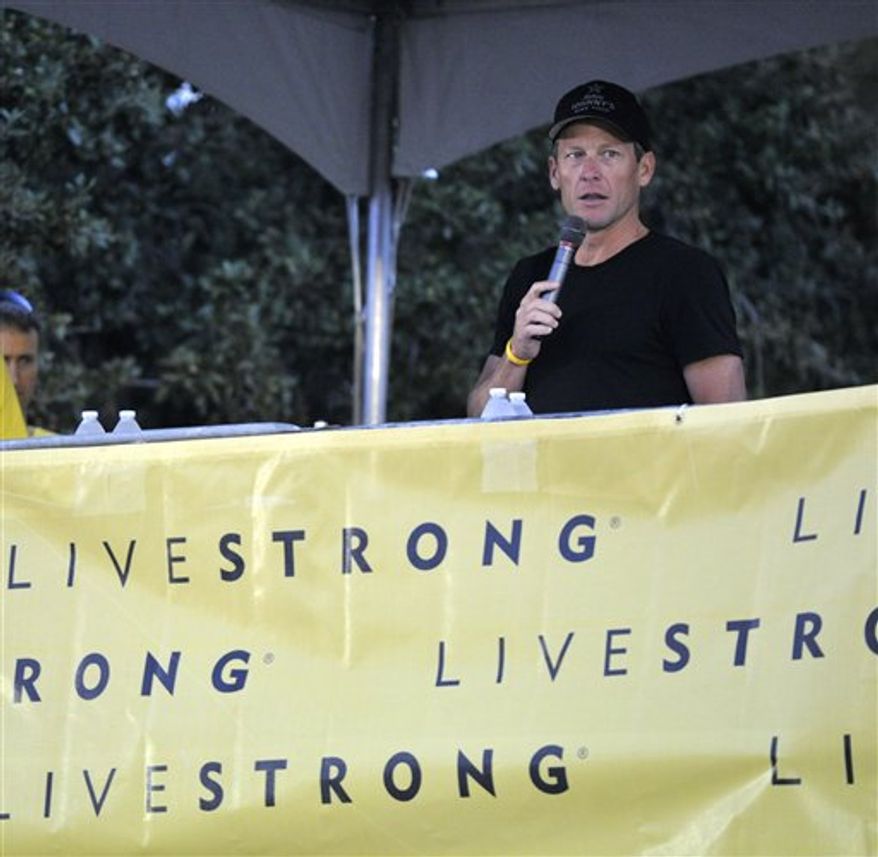 Lance Armstrong speaks at the Livestrong Challenge Austin bike ride Sunday, Oct. 21, 2012, in Austin, Texas. (AP Photo/Michael Thomas)