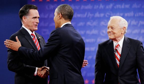 Moderator Bob Schieffer, right, watches as President Barack Obama, center, shakes hands with Republican presidential nominee Mitt Romney during the third presidential debate at Lynn University. (AP Photo/Eric Gay)