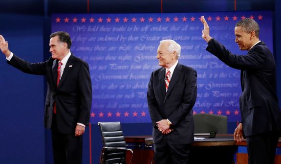 Moderator Bob Schieffer, center, watches as Republican presidential nominee Mitt Romney, left and President Barack Obama  wave to members of the audience during the third presidential debate at Lynn University, Monday, Oct. 22, 2012, in Boca Raton, Fla. (AP Photo/Eric Gay)
