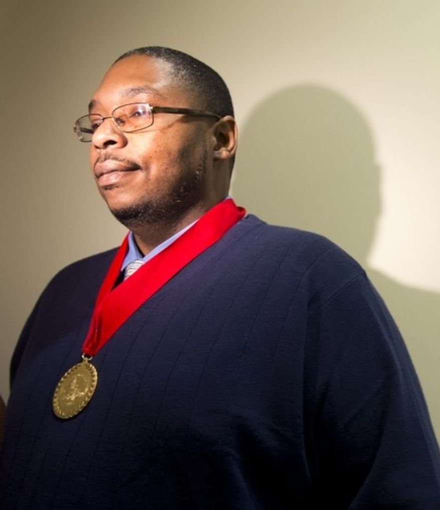 Leonard Johnson, building manager for the Family Research Council who was shot on Aug. 15 when a gunman entered the lobby of the FRC building, was awarded a Medal of Honor by Mayor Vincent Gray on Monday, Oct. 22, 2012. The ceremony was closed to the media. Mr. Johnson was the first recipient of the Mayor's Medal of Honor and is credited with saving many lives. (Barbara L. Salisbury/The Washington Times)