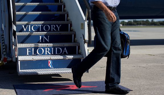 Republican presidential candidate, former Massachusetts Gov. Mitt Romney steps off his campaign plane at Palm Beach International Airport, Saturday, Oct. 20, 2012, in Daytona Beach, Fla.  (AP Photo/ Evan Vucci)