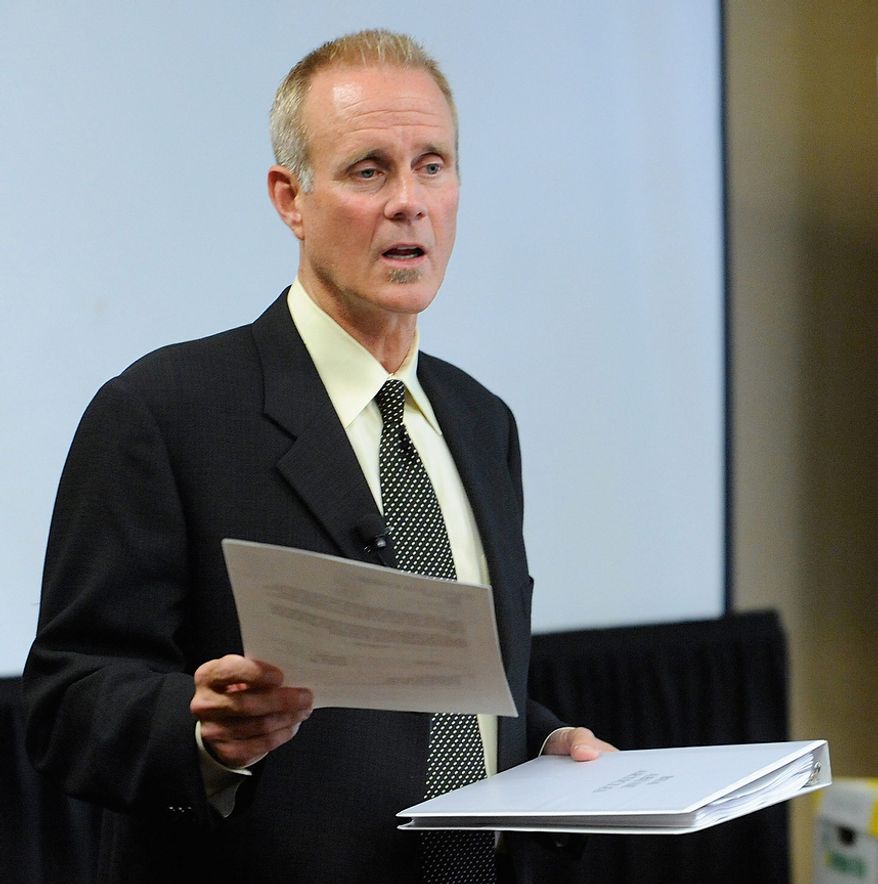Portland attorney Kelly Clark holds a letter at an Oct., 18, 2012, press conference in Portland, Ore., to the U.S. Congress regarding some of the 14,500 pages of previously confidential documents created by the Boy Scouts of America concerning child sexual abuse within the organization. The documents were publicly released despite The Boy Scouts' fight to keep those files confidential. (Associated Press)