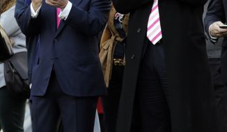 New England Patriots owner Robert Kraft, left, and businessman Donald Trump, right, applaud on the field before an NFL football game between the Patriots and the New York Jets in Foxborough, Mass., Sunday, Oct. 21, 2012. (AP Photo/Charles Krupa)