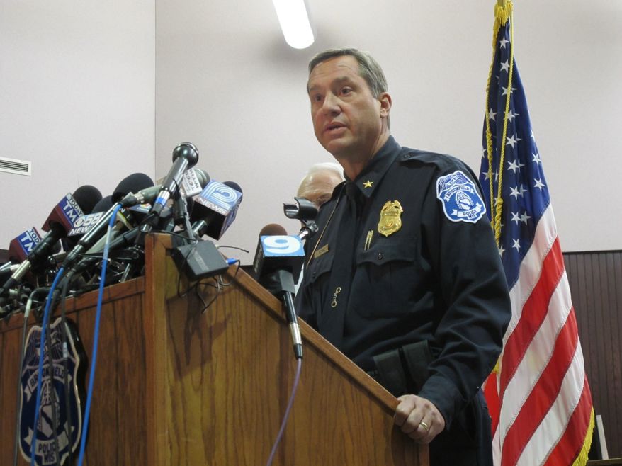 Brookfield Police Chief Dan Tushaus briefs reporters in an evening news conference in Brookfield, Wis., on Oct. 21, 2012, after a man who had been accused of domestic violence and slashing his wife's tires took a gun into the spa where she worked and shot seven women, three fatally, before killing himself. (Associated Press)