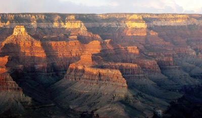 Pictures that inspire awe can be beneficial in hectic lives. The Grand Canyon, beckoning with the colors of a late-fall sunset, is an example of awe-inspiring nature, which psychologists say causes people to feel their "experiences are fuller, that more can happen or be accomplished during a period of time," Melanie Rudd says. (Associated Press)