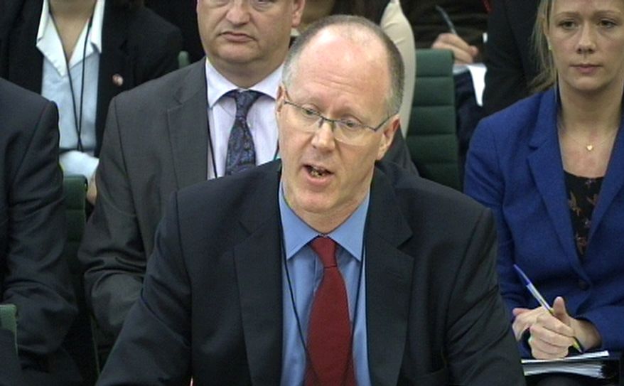 BBC Director-General George Entwistle gives evidence on the Jimmy Savile sexual-abuse case to the Culture, Media and Sport Committee of the House of Commons in London on Tuesday, Oct. 23, 2012. (AP Photo/Press Association)