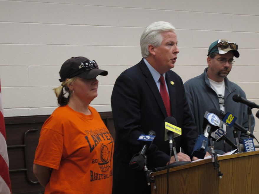 Jennifer Cornwell and Anthony Pasquale, parents of missing 12-year-old girl Autumn Pasquale, watch as Gloucester County Prosecutor Sean Dalton speaks Oct. 22, 2012, in Clayton, N.J., about the search for their daughter. The girl was last seen Oct. 20. (Associated Press)