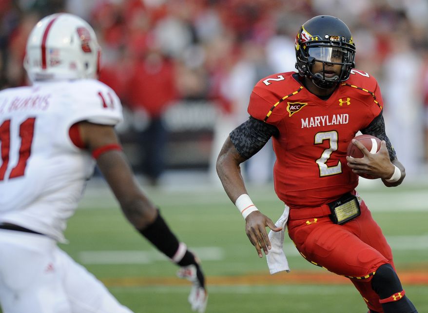 Maryland quarterback Devin Burns (2) runs with the ball against North Carolina State defensive back Juston Burris (11) during the second half of an NCAA college football game, Saturday, Oct. 20, 2012, in College Park, Md. North Carolina State won 20-18. (AP Photo/Nick Wass)