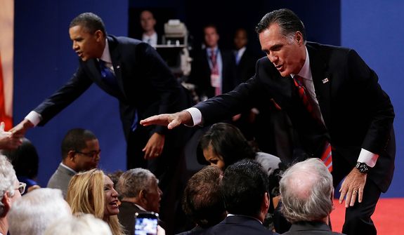 Republican presidential nominee Mitt Romney, right, and President Barack Obama shake hands with audience members following the third presidential debate at Lynn University, Monday, Oct. 22, 2012, in Boca Raton, Fla. (AP Photo/Eric Gay) 