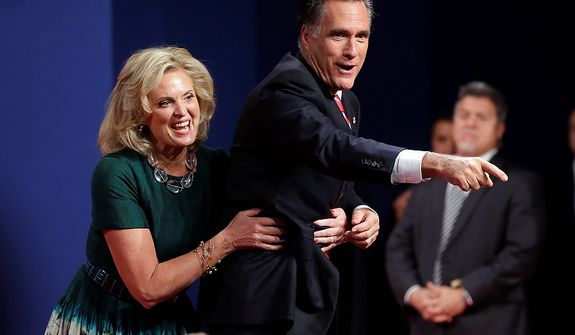 Ann Romney, wife of Republican presidential candidate, former Massachusetts Gov. Mitt Romney, laughs as she pulls her husband away from the edge of the stage after the third presidential debate with President Barack Obama at Lynn University, Monday, Oct. 22, 2012, in Boca Raton, Fla. (AP Photo/Pablo Martinez Monsivais)