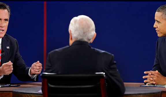 Republican presidential nominee Mitt Romney answers a question and President Barack Obama listens during the third presidential debate at Lynn University, Monday, Oct. 22, 2012, in Boca Raton, Fla. (AP Photo/Charlie Neibergall) 