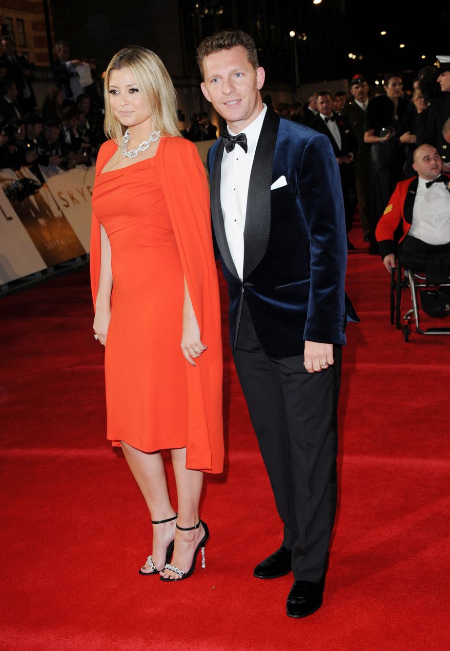 Model-actress Holly Valance, left, and developer Nick Candy arrive at the world premiere of "Skyfall" at the Royal Albert Hall on Tuesday, Oct. 23, 2012 in London. (Photo by Stewart Wilson/Invision/AP)