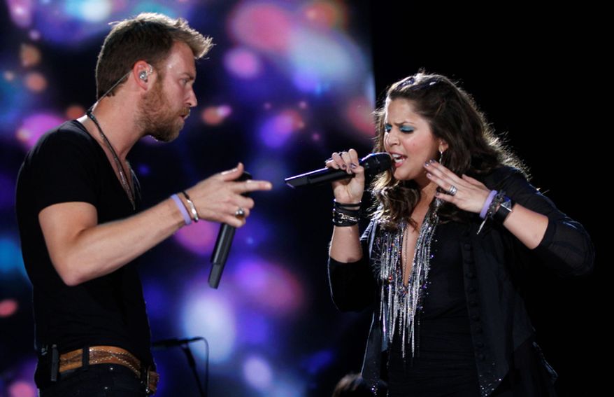 **FILE** Charles Kelley (left) and Hillary Scott of the group Lady Antebellum perform June 7, 2012, at the 2012 CMA Festival in Nashville, Tenn. (Wade Payne/Invision/Associated Press)