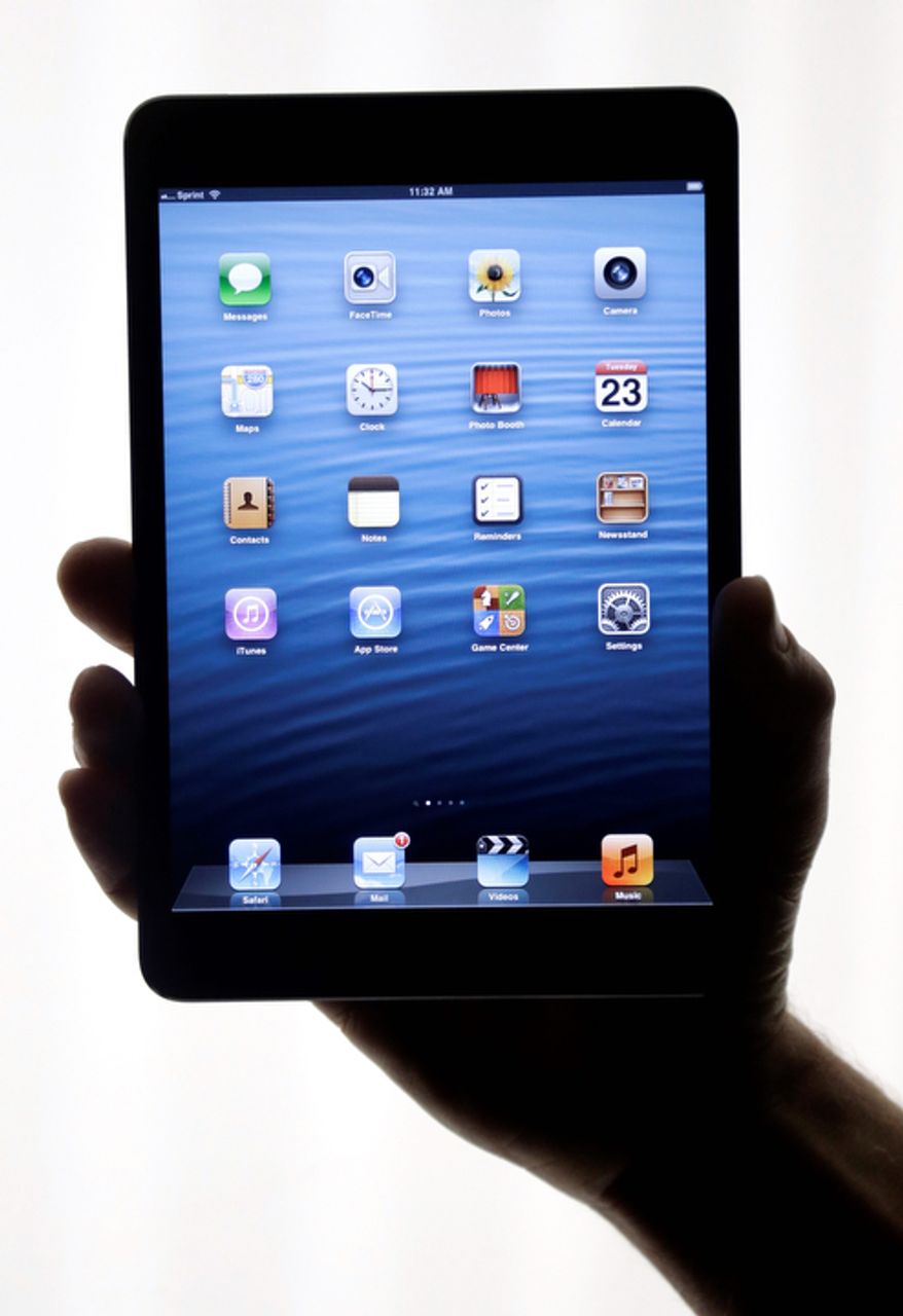 The iPad Mini is shown in San Jose, Calif., on Tuesday, Oct. 23, 2012. Apple Inc. is refusing to compete on price with its rivals in the tablet market, as the company is pricing the new, smaller iPad well above the competition. The iPad Mini, with a screen that's about two-thirds the size of the full-size model, will cost $329 and up. (AP Photo/Marcio Jose Sanchez)