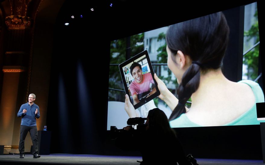 Apple CEO Tim Cook speaks about the iPad's impact on the marketplace during the introduction of the iPad Mini in San Jose, Calif., on Tuesday, Oct. 23, 2012. The device has a screen that's about two-thirds the size of the full-size model and will cost $329 and up. (AP Photo/Marcio Jose Sanchez)