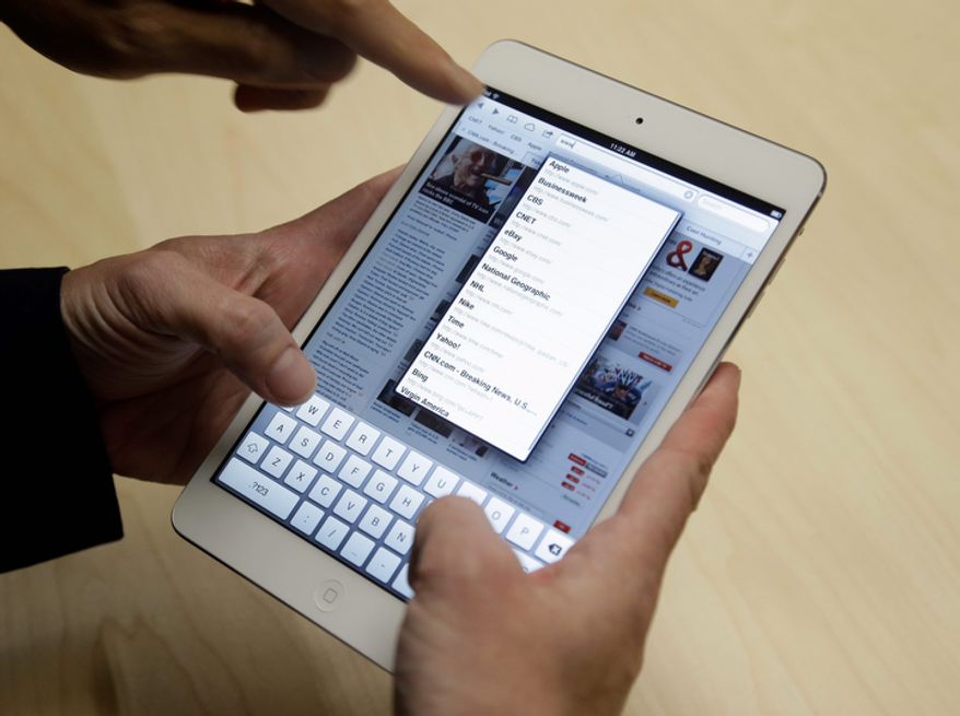 The iPad Mini is shown in San Jose, Calif., on Tuesday, Oct. 23, 2012. The device has a screen that's about two-thirds the size of the full-size model and will cost $329 and up. (AP Photo/Marcio Jose Sanchez)