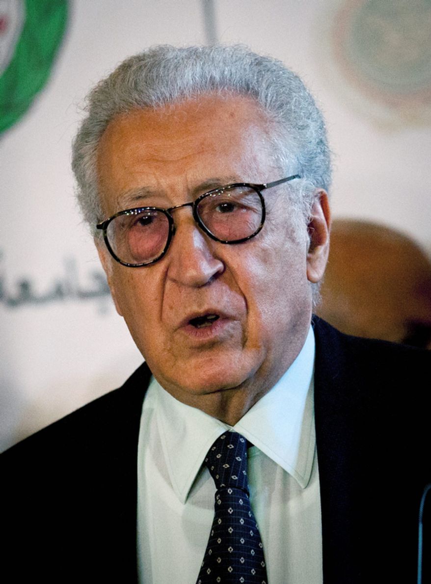 Lakhdar Brahimi, the U.N.-Arab League envoy to Syria, talks during a joint press conference with Arab League Secretary-General Nabil Elaraby (unseen) following their meeting at the league headquarters in Cairo on Wednesday, Oct. 24, 2012. Mr. Brahimi says the Syrian government and some rebel leaders have agreed to a cease-fire during the upcoming four-day Muslim holiday. (AP Photo/Nasser Nasser)