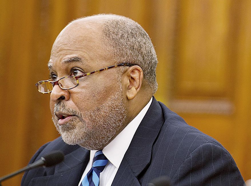 ** FILE ** In this Oct. 25, 2012, file photo, William P. White, D.C. Department of Insurance, Securities and Banking chief, testifies at an oversight hearing on Chartered Health Plan. (Barbara L. Salisbury/The Washington Times)