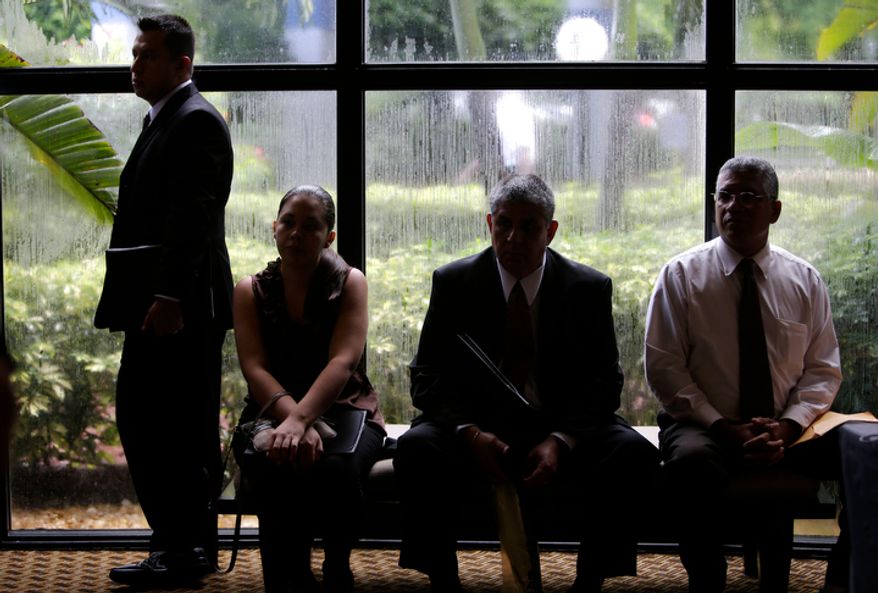 Job applicants wait for the opening of a job fair held by National Career Fairs in Fort Lauderdale, Fla., on Monday, Sept. 17, 2012. (AP Photo/Lynne Sladky)