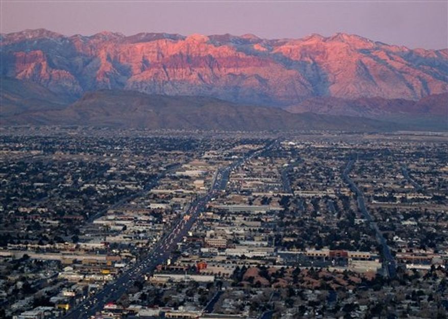 ** FILE ** This Feb. 9, 2005, file photo, shows the suburbs of Las Vegas from atop the Stratosphere tower looking west down Sahara Avenue towards the Spring Mountains. New census data released Thursday, Oct. 25, 2012, offer a detailed look at U.S. migration as mobility begins to revive after sliding to a record low last year. (AP Photo/Joe Cavaretta, File)