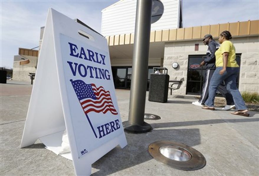 Oliver Solomon, of Davenport, Iowa, and his wife LaDonna arrive at the Davenport Public Library before casting their ballot for the Nov. 6th election, Wednesday, Oct. 24, 2012, in Davenport, Iowa. Early voting for the Nov. 6th election likely will set an Iowa record, as presidential candidates seek to lock-in votes in the battleground state. (AP Photo/Charlie Neibergall)