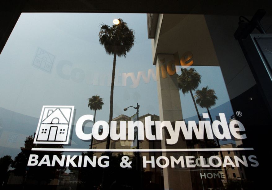 In this June 25, 2008, photo, buildings and palm trees are reflected on the entrance of the Countrywide Financial Corp. office in Beverly Hills, Calif. The top federal prosecutor in Manhattan sued Bank of America, which acquired Countrywide in 2008, for more than $1 billion on Wednesday, Oct. 24, 2012, for mortgage fraud against Fannie Mae and Freddie Mac during the years around the financial crisis. (AP Photo/Kevork Djansezian)