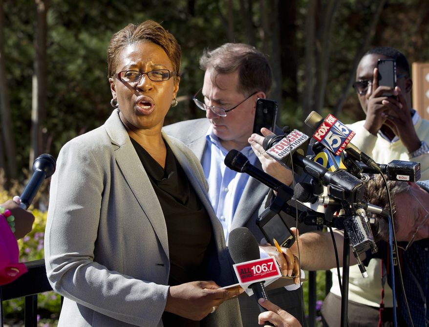 Cpl. Kay Lester, Fulton County police spokeswoman, speaks to reporters outside the World Changers International church in College Park, Ga., after a fatal shooting inside on Wednesday, Oct. 24, 2012. Police say a volunteer leading a prayer service was shot and killed by a former church employee. (AP Photo/John Bazemore)