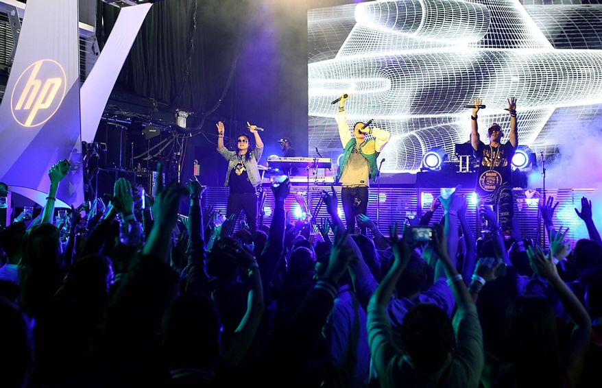 In this photo provided by HP, Far East Movement performs to celebrate the launch of HP's new line of Windows 8 touch-technology products Wednesday, Oct. 24, 2012 in New York. On Thursday in New York, Microsoft will unveil a dramatic overhaul of its ubiquitous Windows operating system. (AP Photo/HP)
