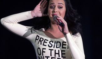 Singer Katy Perry performs Oct. 24, 2012, for a crowd before the arrival of President Obama at a campaign rally in Las Vegas. (Associated Press)
