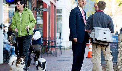 Rob Sobhani (center), an independent candidate for U.S. Senate from Maryland, talks with Brian Phipps (right) of Arnold, Md., along the downtown harbor in Annapolis on Wednesday, Oct. 17, 2012. (Andrew Harnik/The Washington Times)