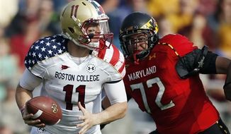 Boston College quarterback Chase Rettig (11) looks to pass under pressure from Maryland defensive lineman Joe Vellano (72) in the second quarter of an NCAA college football game in Boston, Saturday, Oct. 27, 2012. (AP Photo/Michael Dwyer)